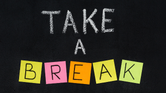 Chalkboard and post-its spell "Take a break"