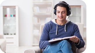 Young man listens to an audiobook