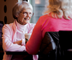 two adults talking at diner