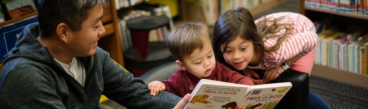 family reading together in the library