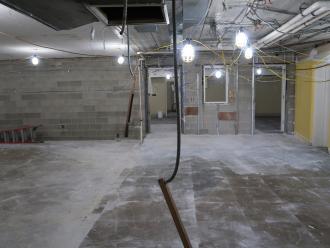 View of construction in basement wall between teens and community room is removed