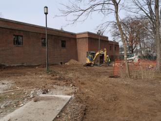 grating the land at back of library