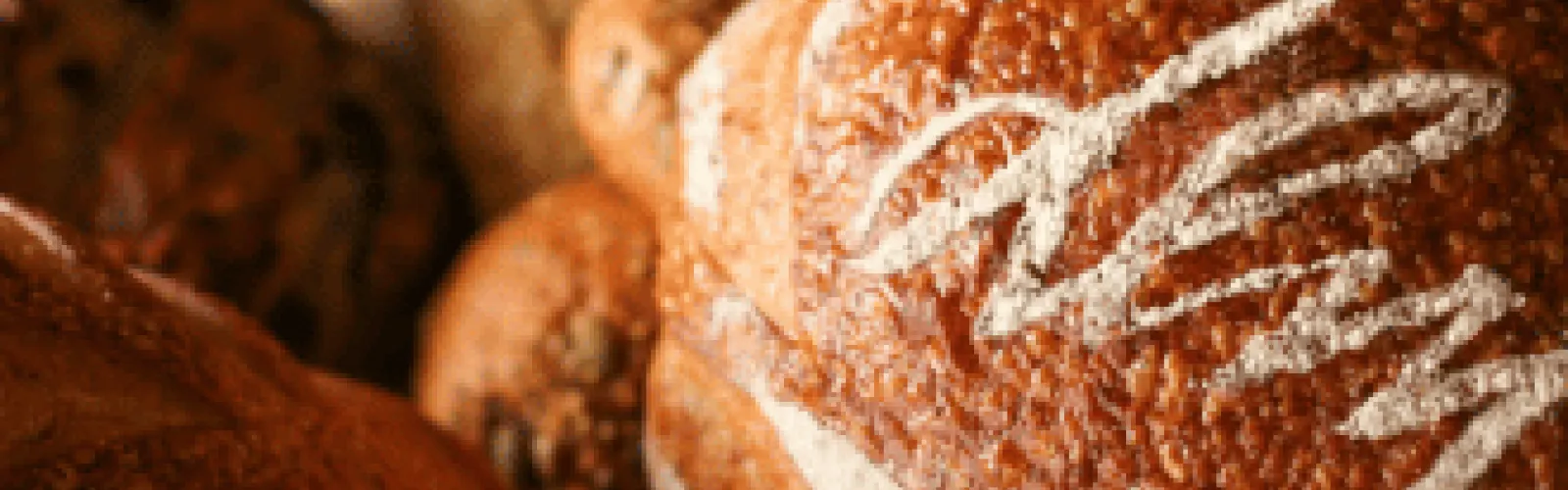Loaf of bread with "DLM" written on it to represent Dorothy Lane Market.