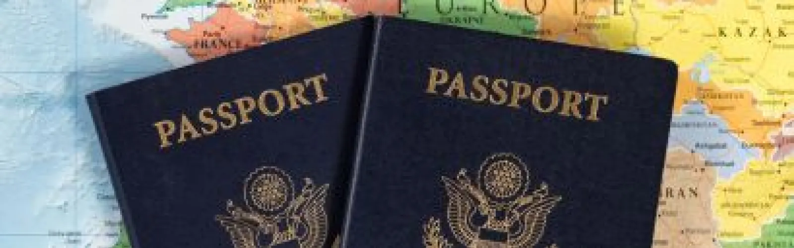 Passports atop a map of Europe